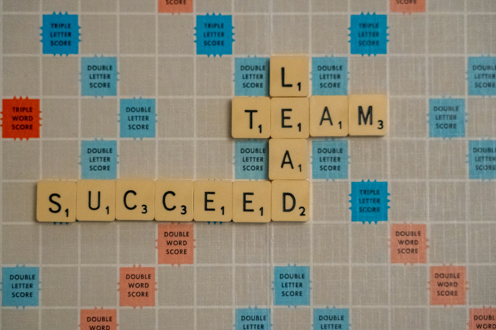 Photo by Nick Fewings scrabbled scrabble tiles with words on them