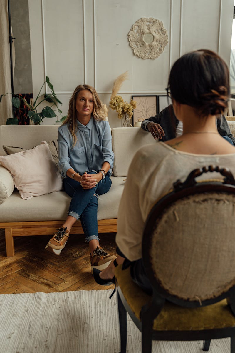 Photo by Antoni Shkraba Studio A therapist and client in discussion during a cozy indoor session highlighting mental health.